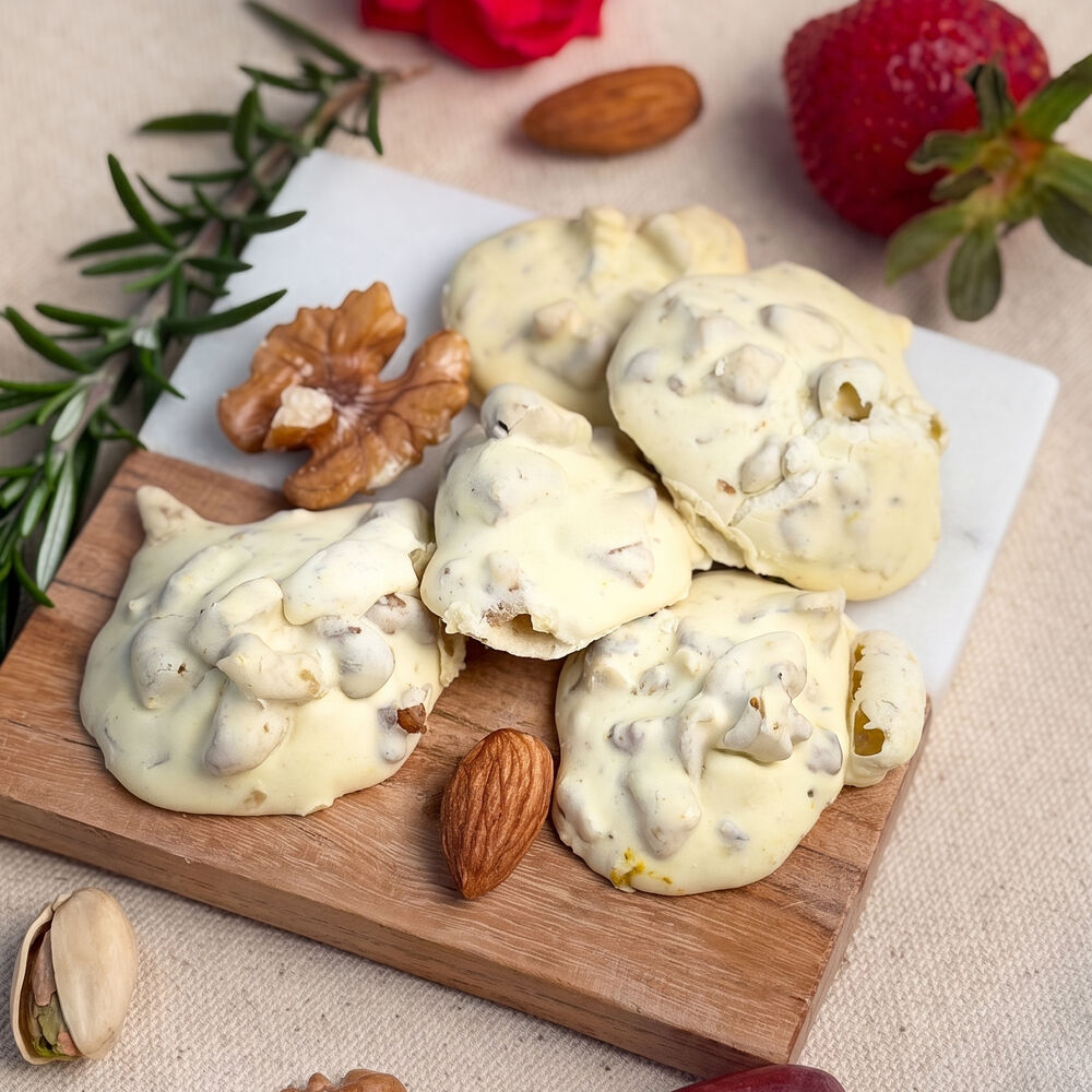 Soft walnut cookies with toasted walnuts and almonds on a wooden board — Honey & Fig Bakery, Pflugerville, Texas